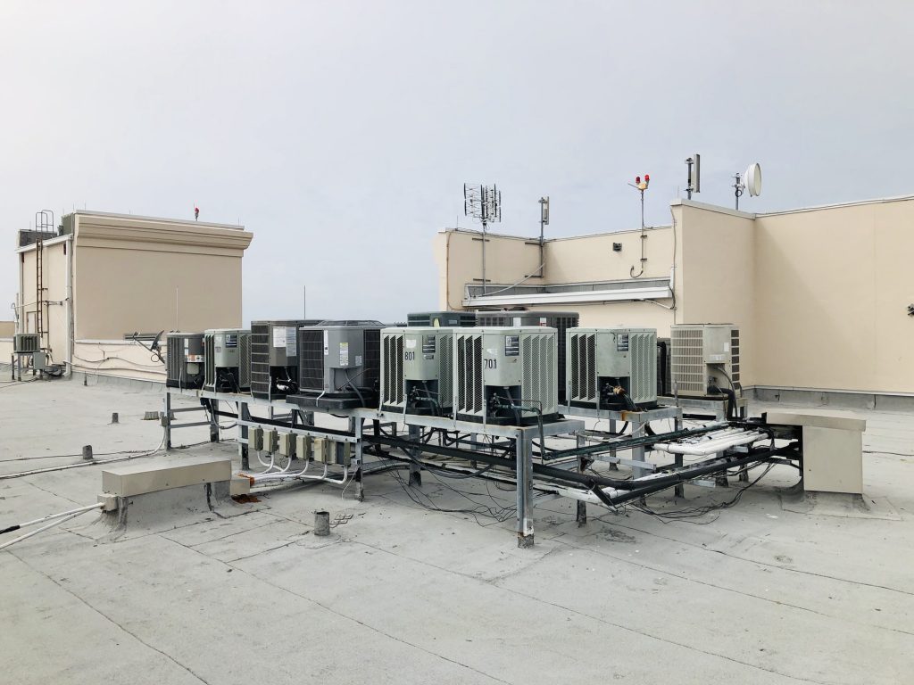 Air conditioning units on roof of a high rise condo building